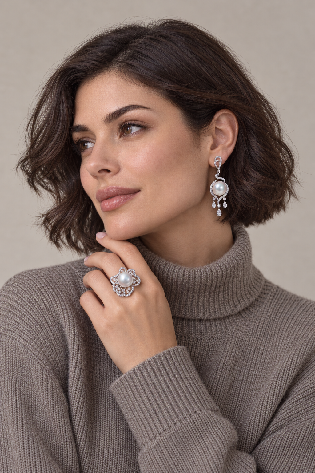 Close view of the set worn showing 11–12mm White South Sea pearl ring and halo tassel stud earrings