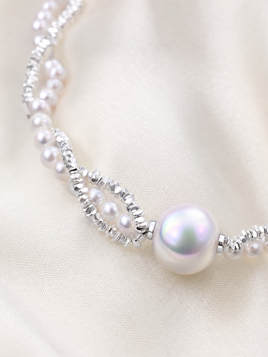 Detail of the White Freshwater Pearl Necklace showing round to near round Edison pearls, mirror-like gloss and pink glow luster