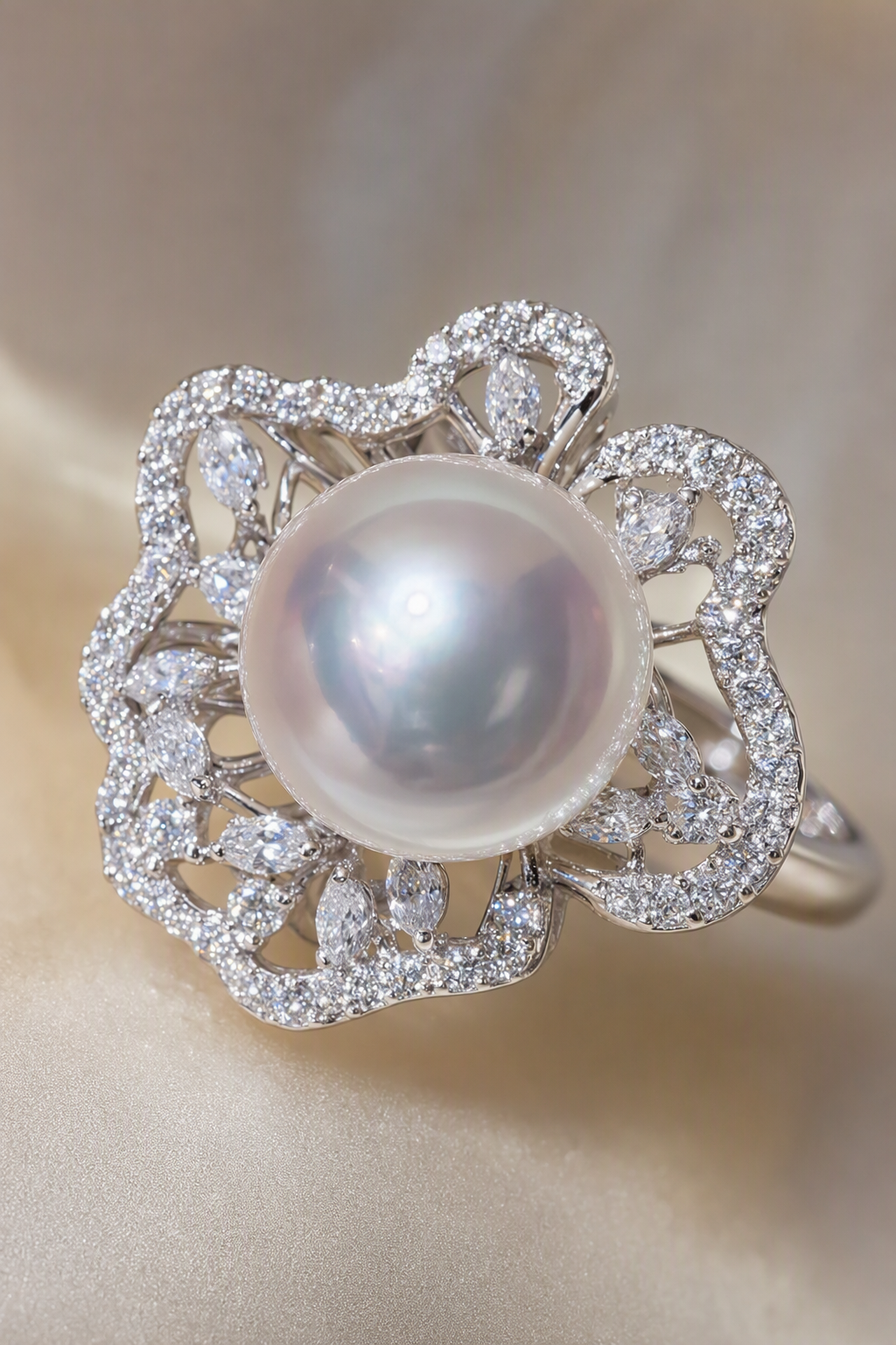 Floral halo detail and near-round 11–12 mm white South Sea pearl on S925 sterling silver ring, close detail