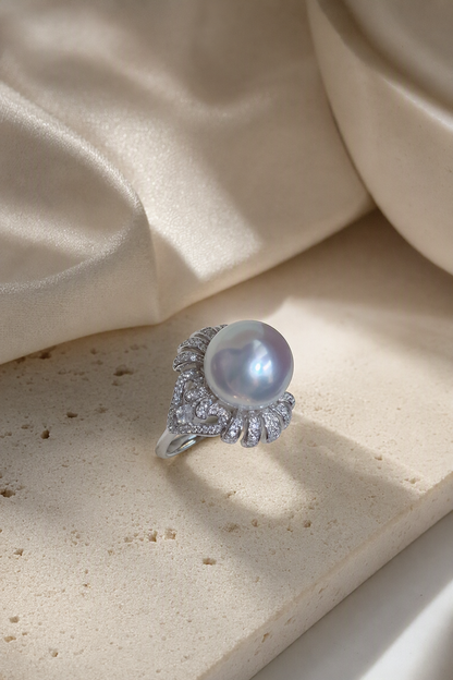 11–12mm White South Sea Pearl Fan Accent Sterling Silver Ring in a still-life ivory silk luxury environment