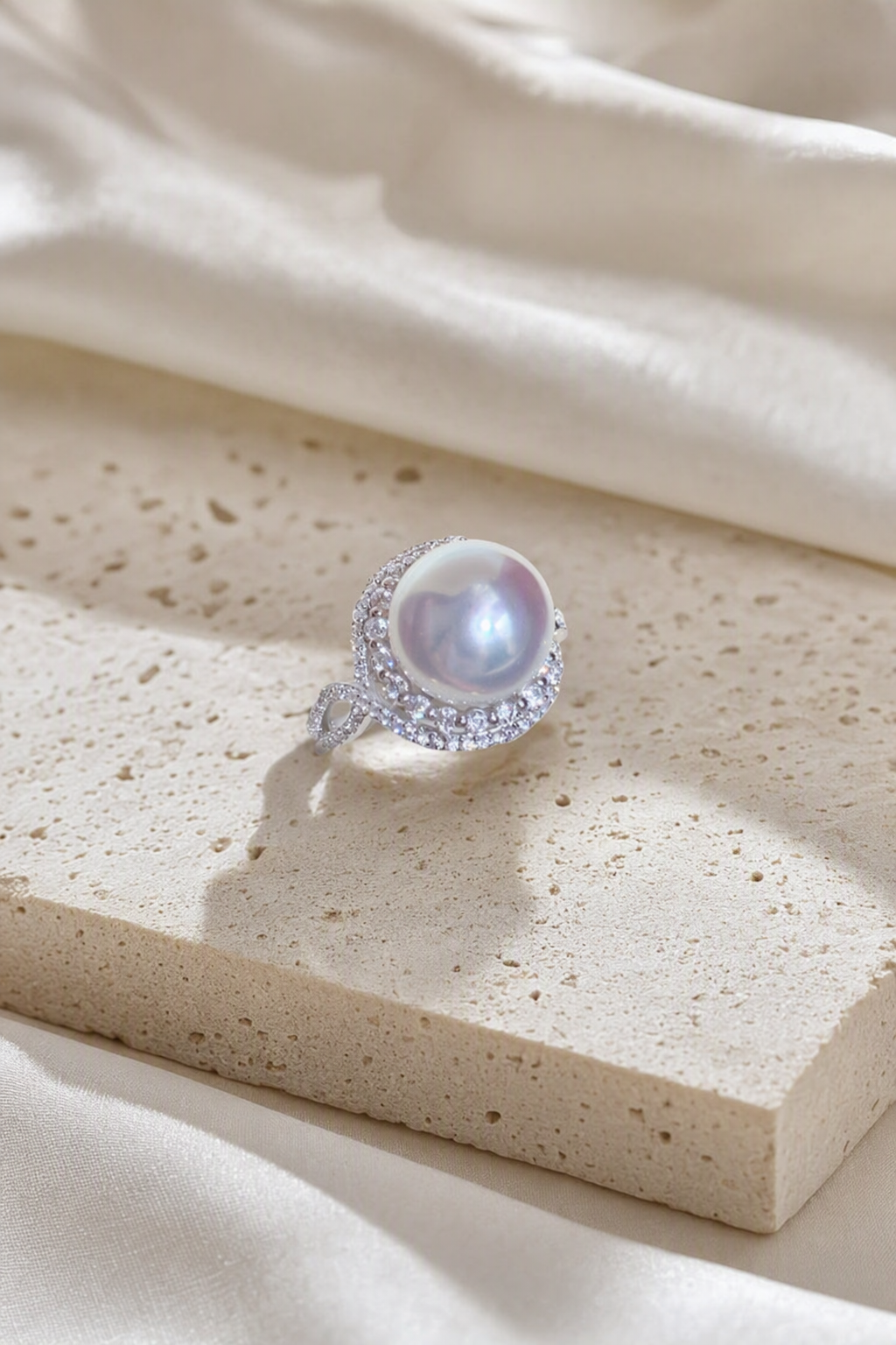 11–12mm White South Sea Pearl Leaf Wrap Sterling Silver Ring in a still-life ivory silk luxury environment