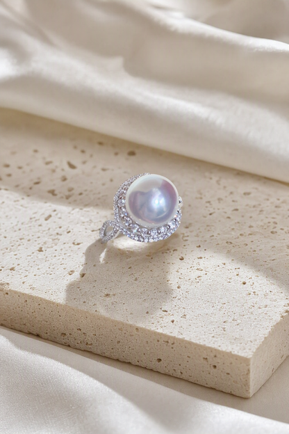 11–12mm White South Sea Pearl Leaf Wrap Sterling Silver Ring in a still-life ivory silk luxury environment
