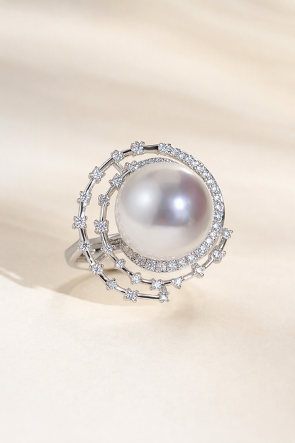 11–12mm White South Sea Pearl Open Halo Sterling Silver Ring on a cream white primary background