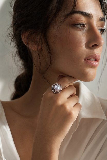 11–12mm White South Sea Pearl Open Halo Sterling Silver Ring naturally worn on the finger by a model