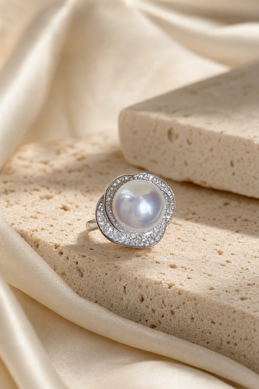 11–12mm White South Sea Pearl Organic Frame Sterling Silver Ring in a still-life ivory silk luxury environment