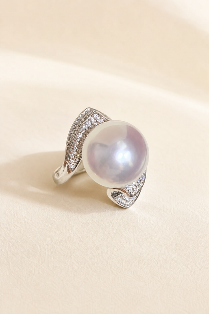 11–12mm White South Sea Pearl Sculptural Wave Sterling Silver Ring on a cream white primary background