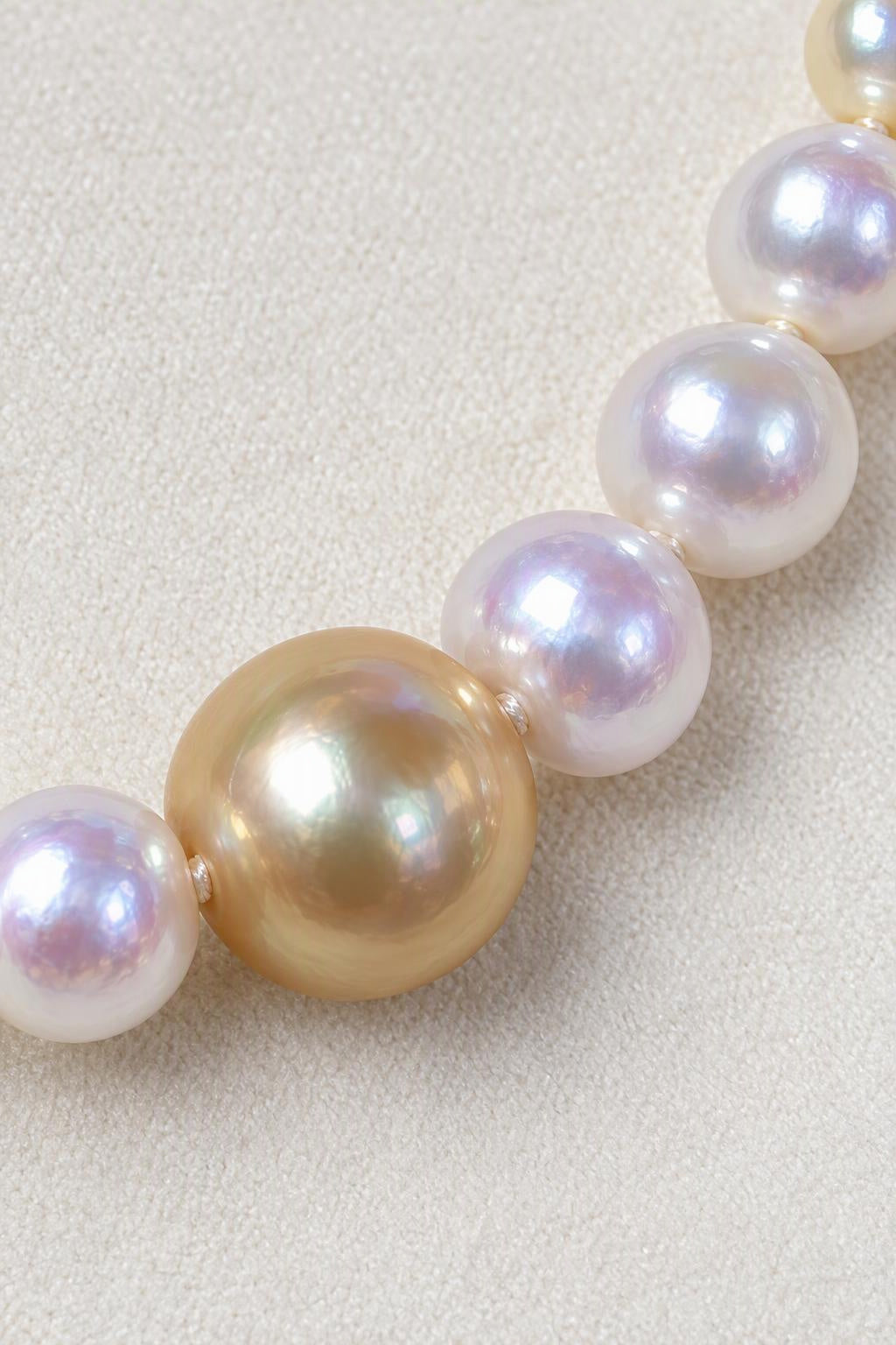 Close-up of High Luster White freshwater pearls 3–8 mm; Golden South Sea focal pearl 12–13 mm Cultured Freshwater Pearl with Golden South Sea Pearl focal necklace showing pearl luster, nacre and craftsmanship detail