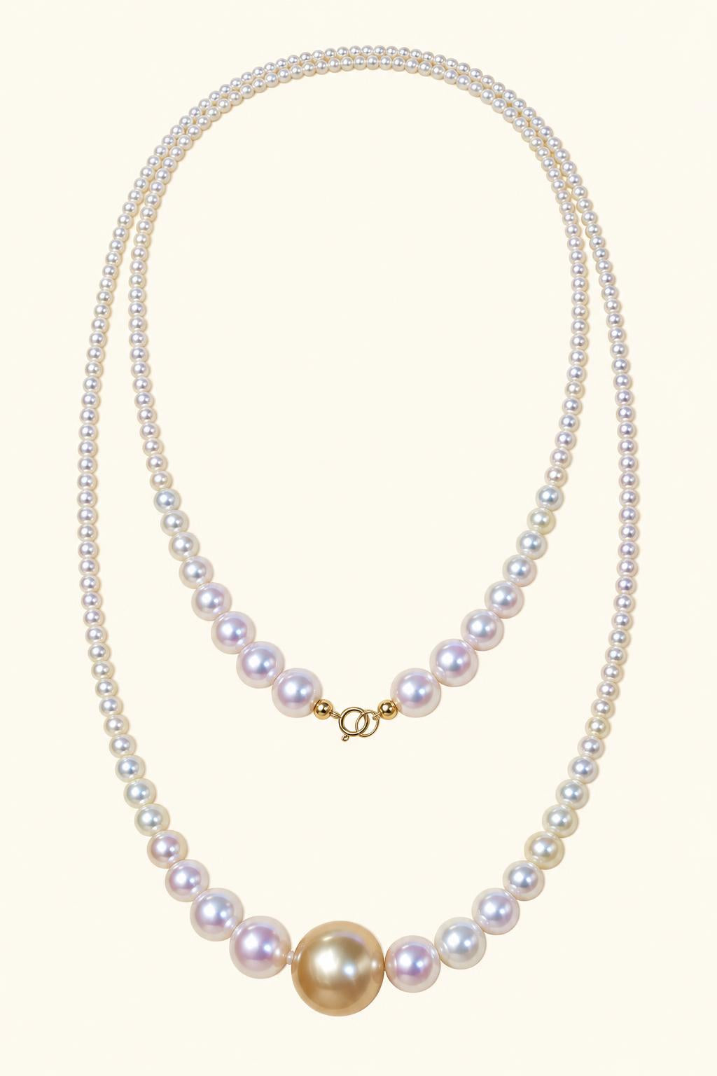 High Luster White freshwater pearls 3–8 mm; Golden South Sea focal pearl 12–13 mm Cultured Freshwater Pearl with Golden South Sea Pearl focal necklace on a cream white background