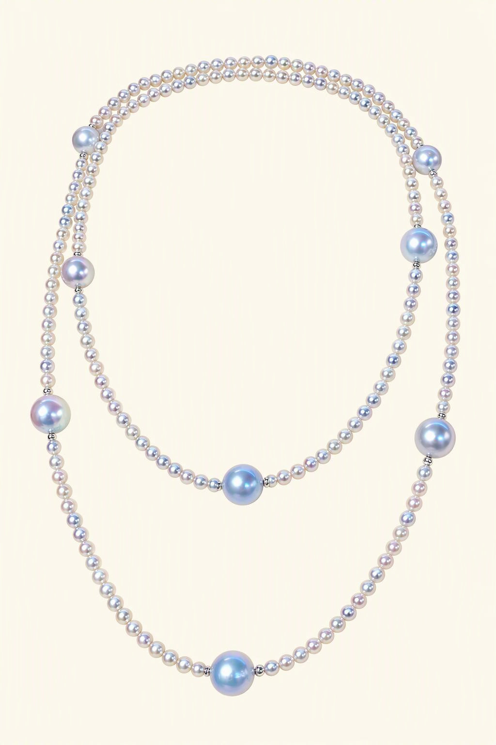 High Luster Small pearls 3.5–4 mm; large blue-gray pearls 8.5–9 mm Cultured Freshwater Pearl necklace on a cream white background