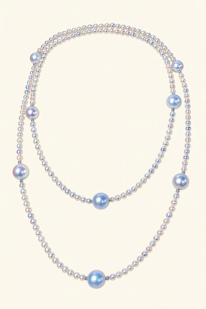 High Luster Small pearls 3.5–4 mm; large blue-gray pearls 8.5–9 mm Cultured Freshwater Pearl necklace on a cream white background