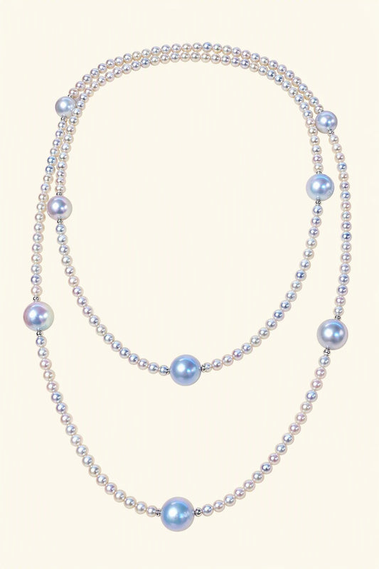 High Luster Small pearls 3.5–4 mm; large blue-gray pearls 8.5–9 mm Cultured Freshwater Pearl necklace on a cream white background