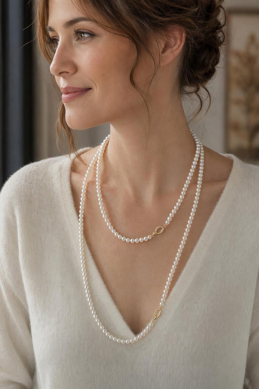 Model wearing High Luster 4.5–5 mm Cultured Freshwater Pearl necklace naturally at the neckline