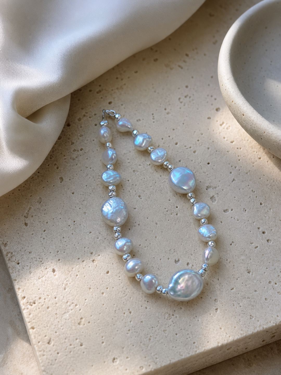 Freshwater baroque pearl bracelet featuring 6-10mm aurora pearls with mirror-like luster