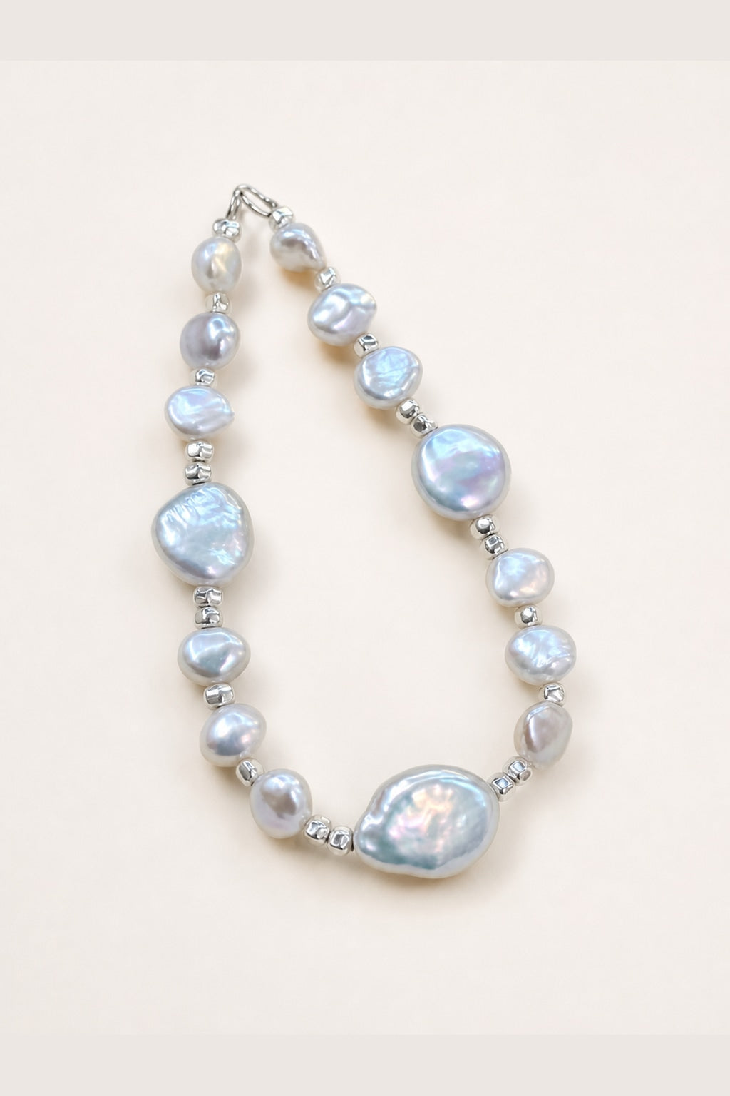 Aurora freshwater pearl bracelet with silver-blue color and mirror-like luster on a clean background