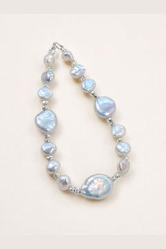 Aurora freshwater pearl bracelet with silver-blue color and mirror-like luster on a clean background