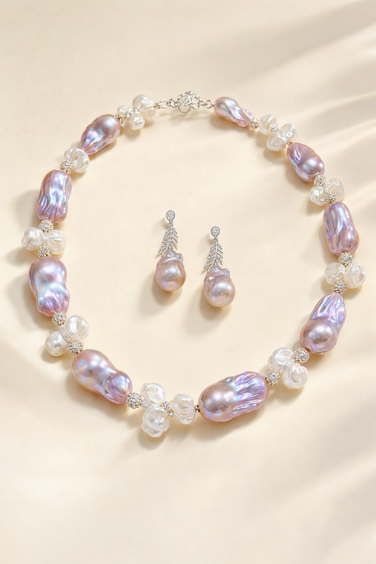 Aurora Luster 20mm+ Freshwater Pearl necklace and earrings set on a cream white background