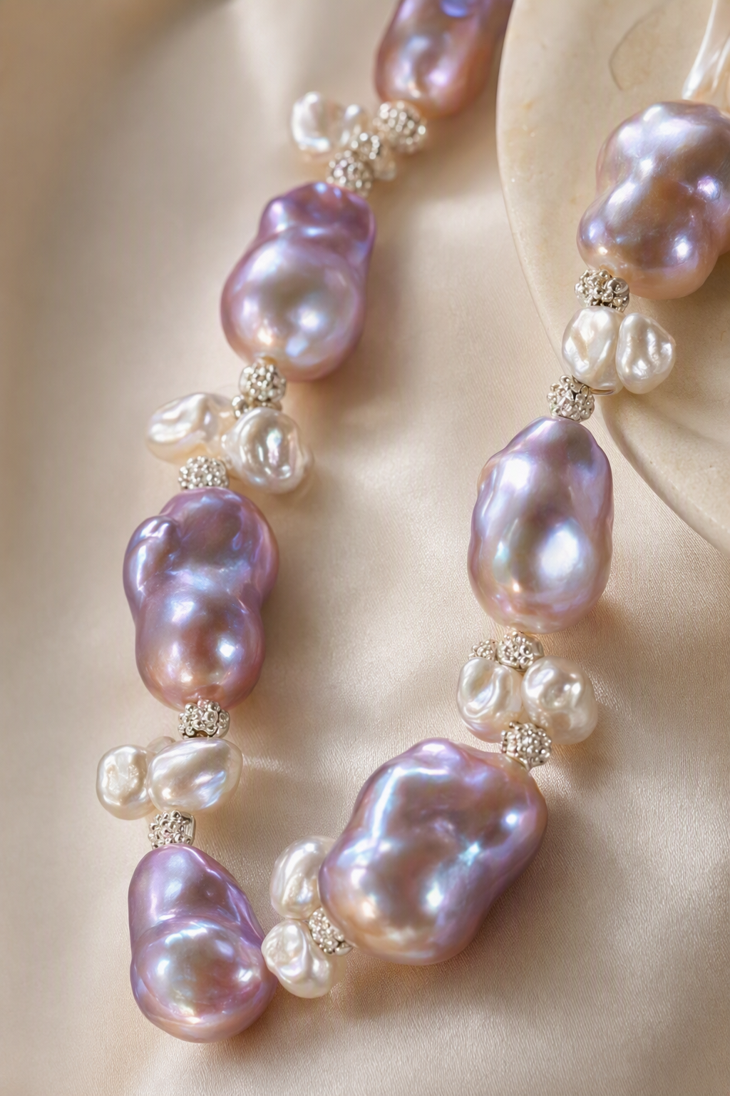 Close-up of Aurora Luster 20mm+ Freshwater Pearl necklace and earrings set showing pearl luster, nacre and craftsmanship detail