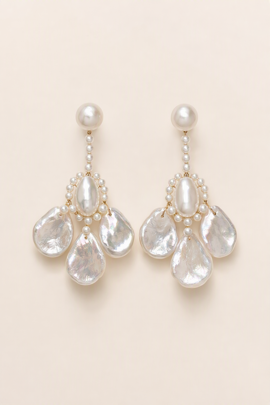 Aurora Luster Custom Freshwater Pearl dangle earrings on a cream white background