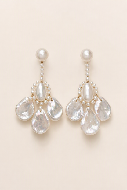 Aurora Luster Custom Freshwater Pearl dangle earrings on a cream white background