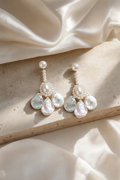 Aurora Luster Custom Freshwater Pearl dangle earrings in an elegant still-life luxury setting