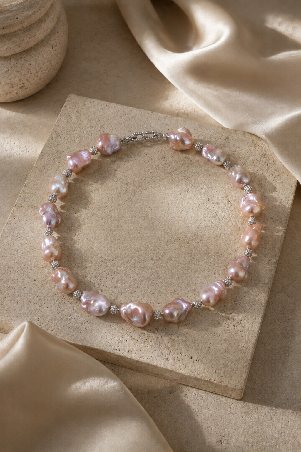 Aurora Luster Freshwater Pearl necklace in an elegant still-life luxury setting