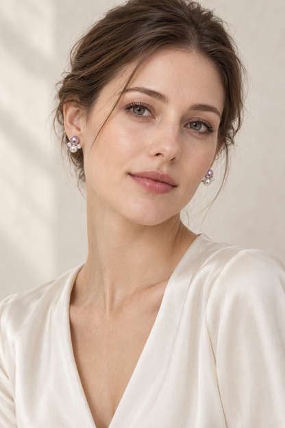 Model wearing Mirror Luster 9–10 mm purple pearl with 6–7 mm white pearl Freshwater Pearl stud earrings naturally at the earlobe