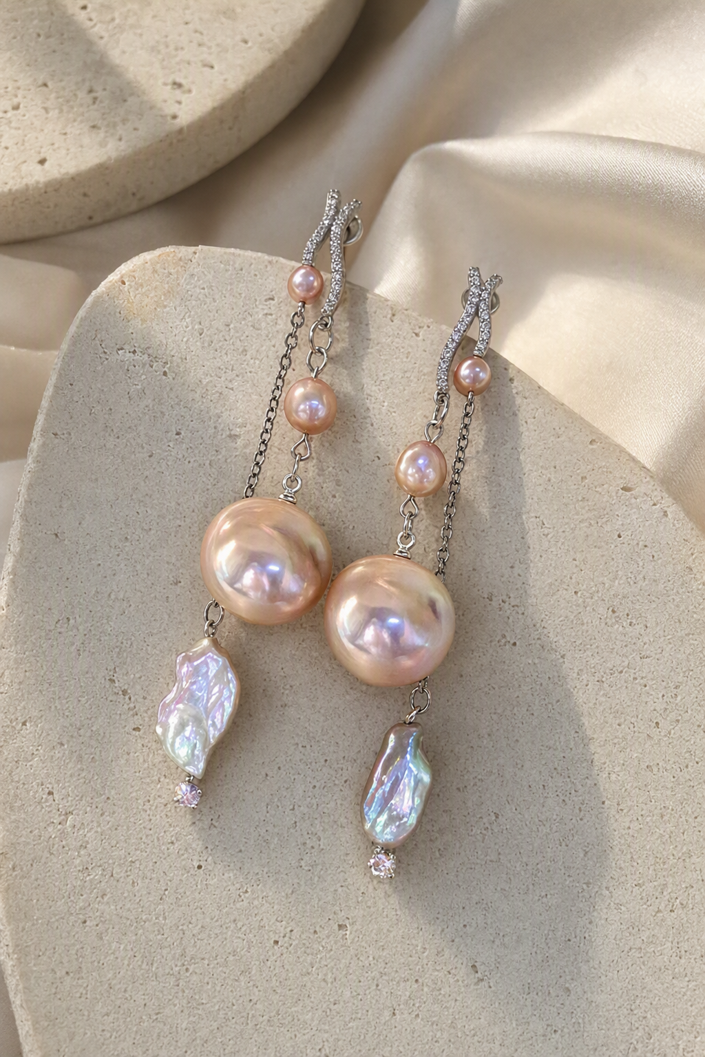 High Luster Freshwater Pearl dangle earrings in an elegant still-life luxury setting
