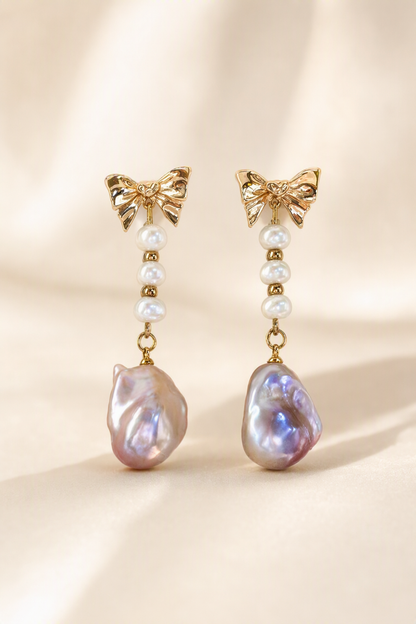 High Luster Freshwater Pearl drop earrings on a cream white background