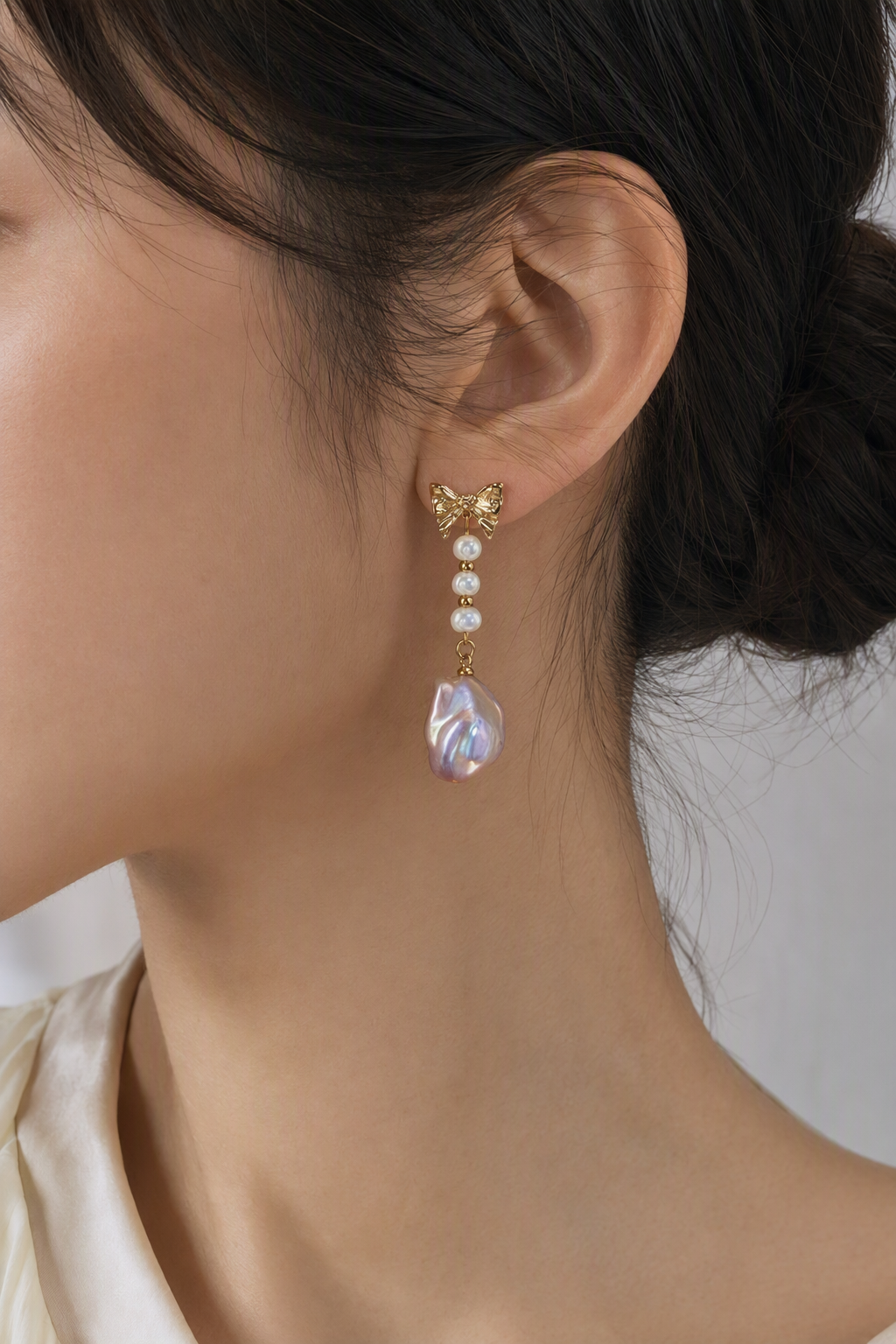 High Luster Freshwater Pearl drop earrings at realistic wearing scale