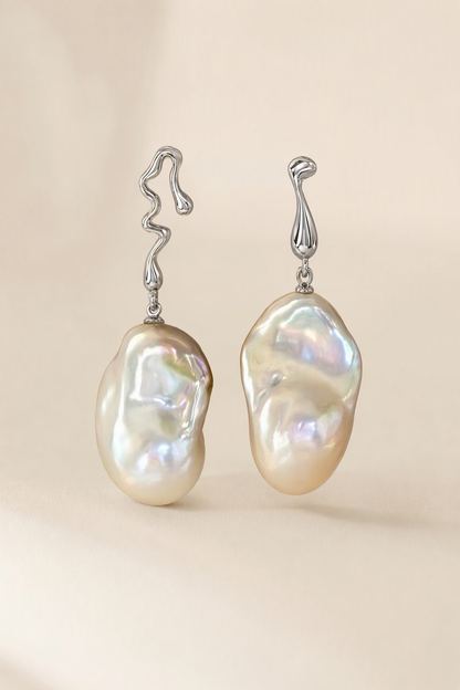 High Luster Freshwater Pearl drop earrings on a cream white background