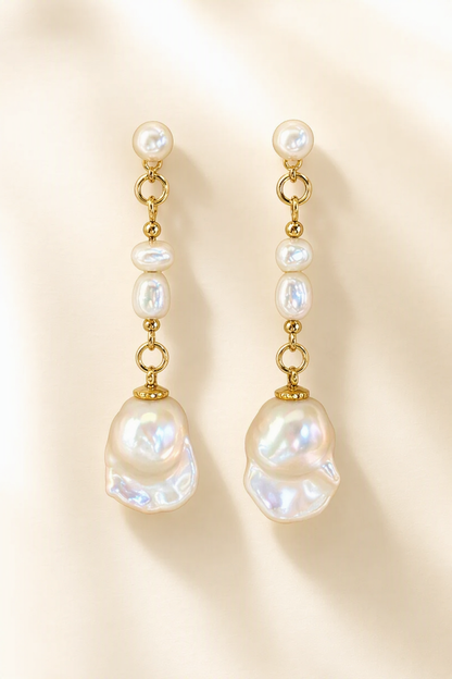 High Luster Freshwater Pearl dangle earrings on a cream white background