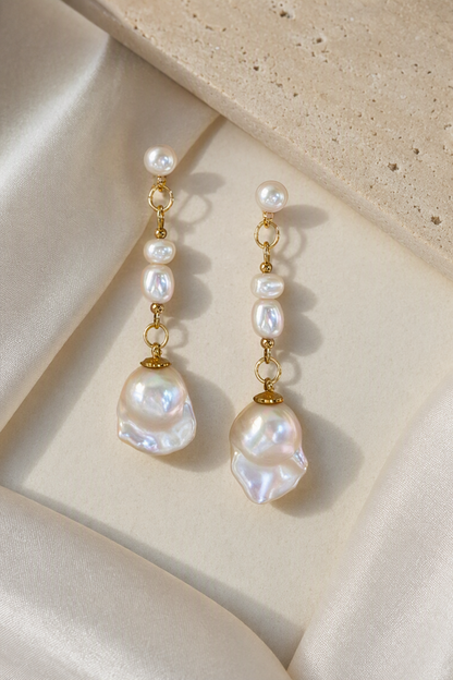 High Luster Freshwater Pearl dangle earrings in an elegant still-life luxury setting