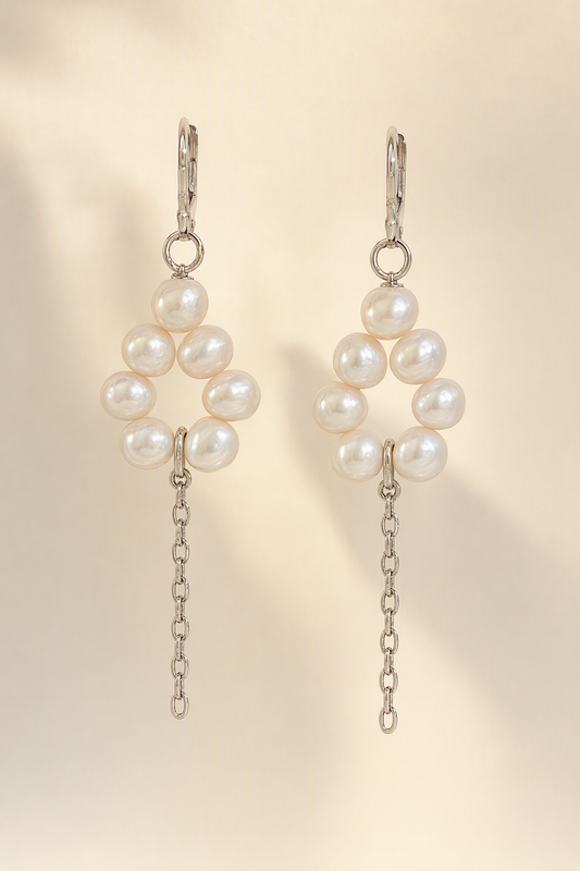 High Luster Freshwater Pearl dangle earrings on a cream white background