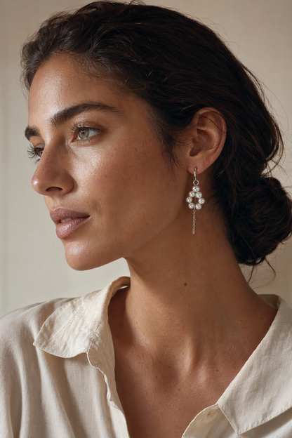 Model wearing High Luster Freshwater Pearl dangle earrings naturally on the earlobe