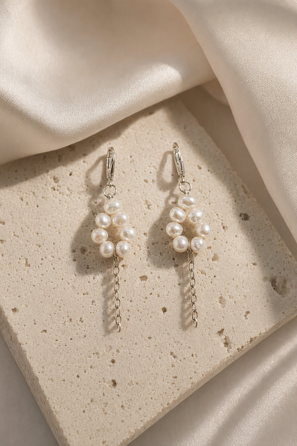 High Luster Freshwater Pearl dangle earrings in an elegant still-life luxury setting
