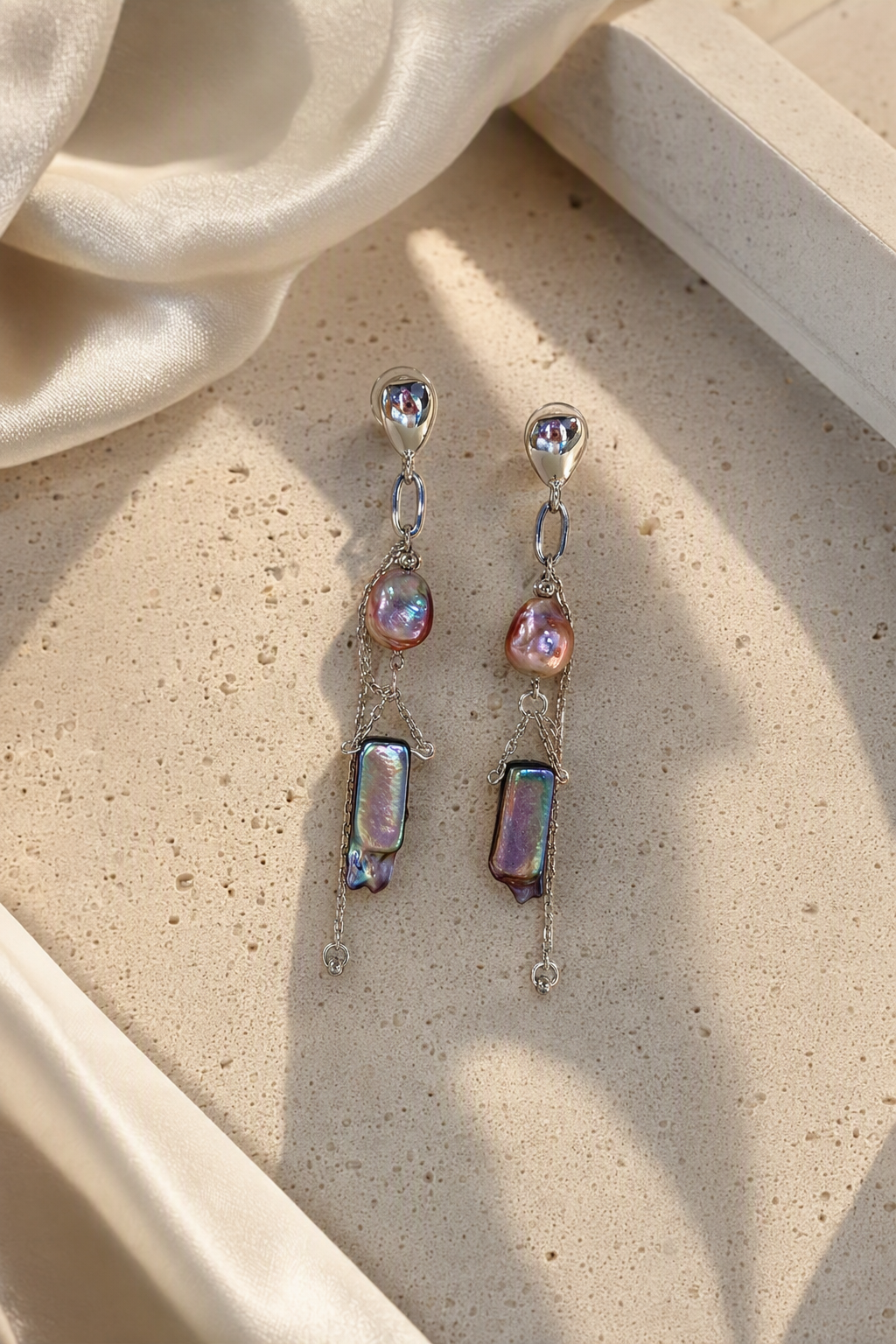 High Luster Freshwater Pearl dangle earrings in an elegant still-life luxury setting