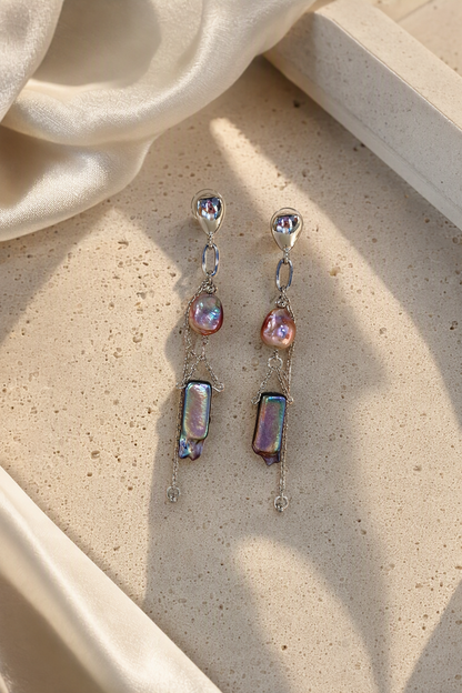 High Luster Freshwater Pearl dangle earrings in an elegant still-life luxury setting