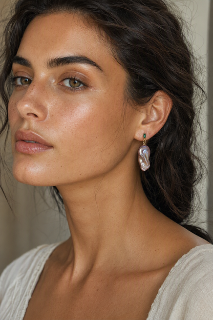 Model wearing High Luster Freshwater Pearl drop earrings naturally on the earlobe