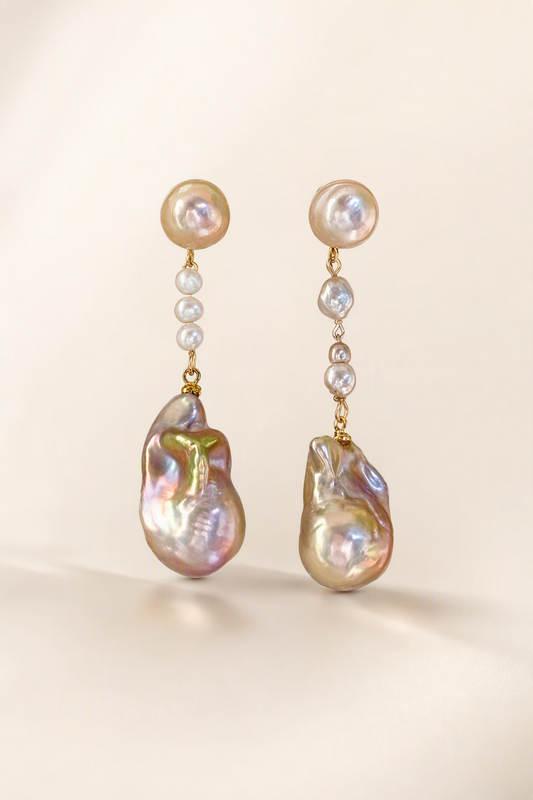 High Luster Freshwater Pearl drop earrings on a cream white background