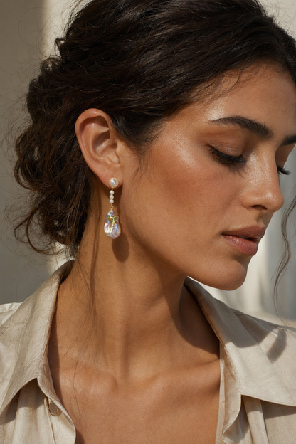 Model wearing High Luster Freshwater Pearl drop earrings naturally on the earlobe