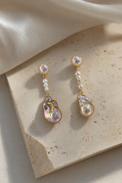 High Luster Freshwater Pearl drop earrings in an elegant still-life luxury setting