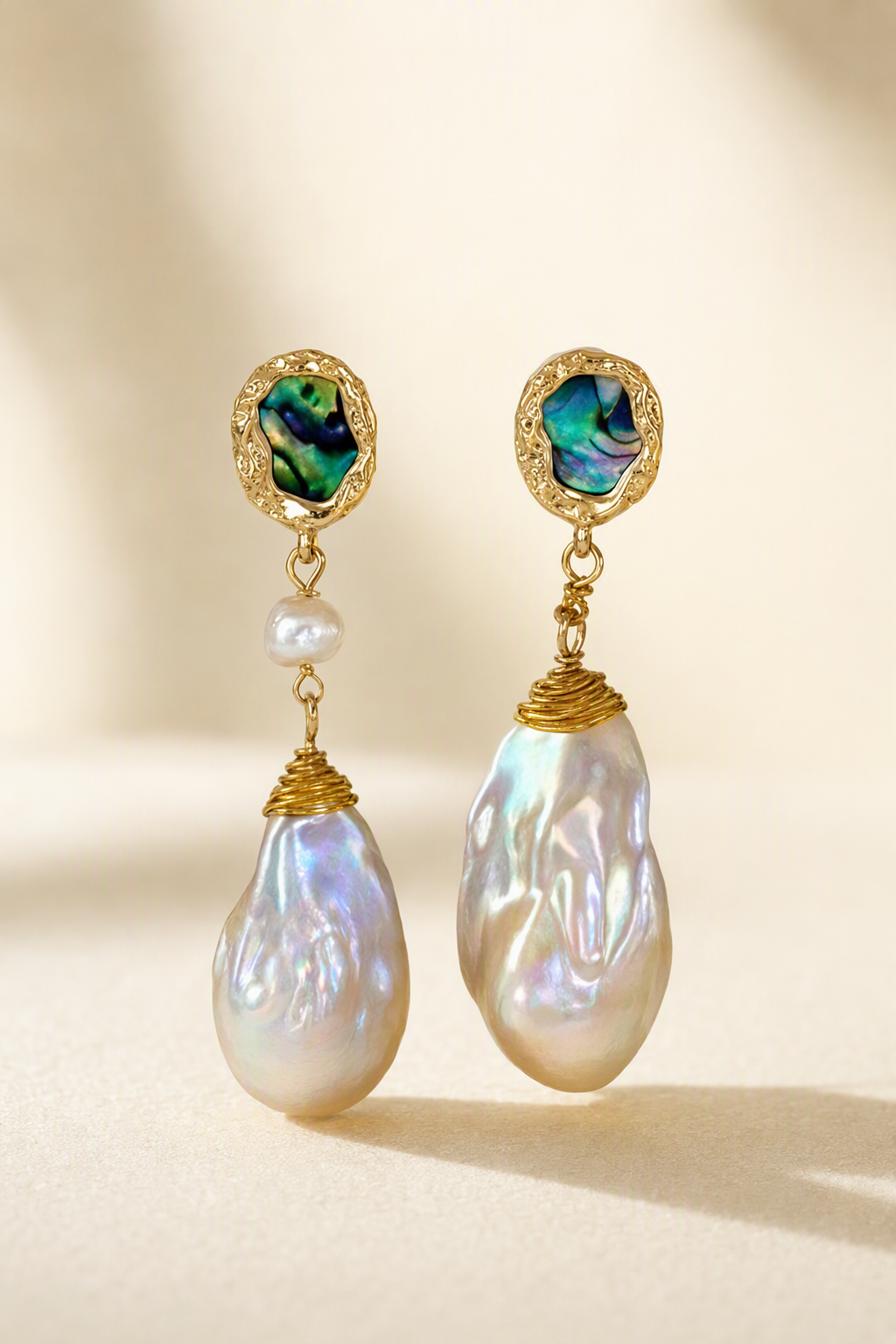 High Luster Freshwater Pearl dangle earrings on a cream white background