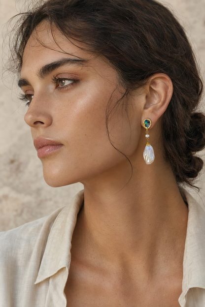 Model wearing High Luster Freshwater Pearl dangle earrings naturally on the earlobe