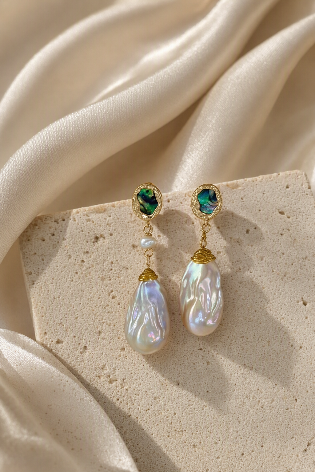 High Luster Freshwater Pearl dangle earrings in an elegant still-life luxury setting