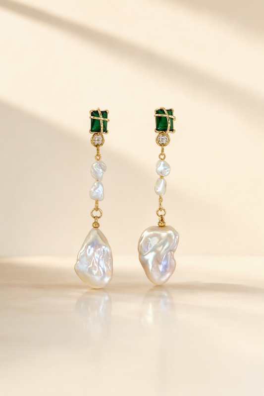 High Luster Freshwater Pearl dangle earrings on a cream white background