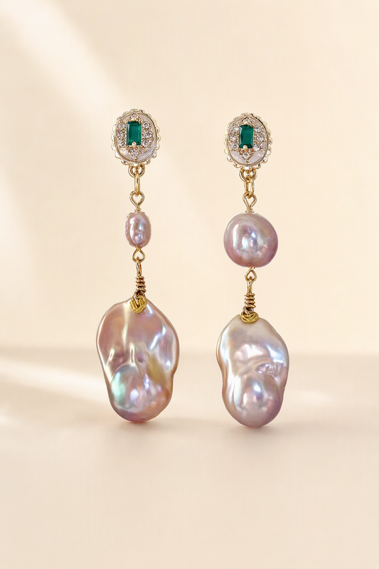 High Luster Freshwater Pearl drop earrings on a cream white background