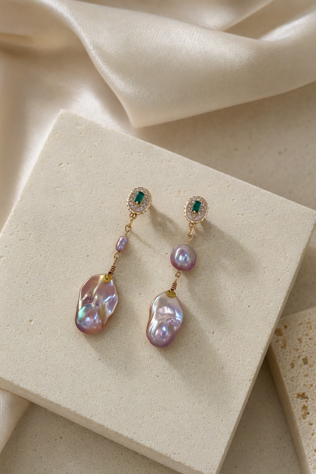 High Luster Freshwater Pearl drop earrings in an elegant still-life luxury setting