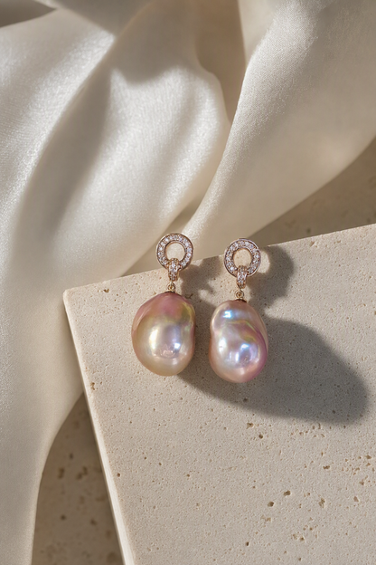 High Luster Freshwater Pearl drop earrings in an elegant still-life luxury setting