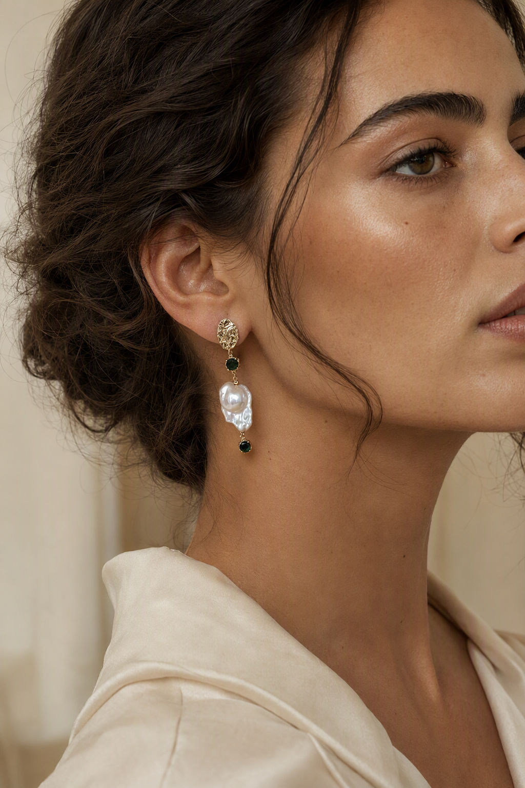 Model wearing High Luster Freshwater Pearl drop earrings naturally on the earlobe
