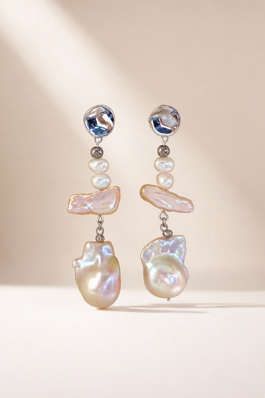 High Luster Freshwater Pearl dangle earrings on a cream white background